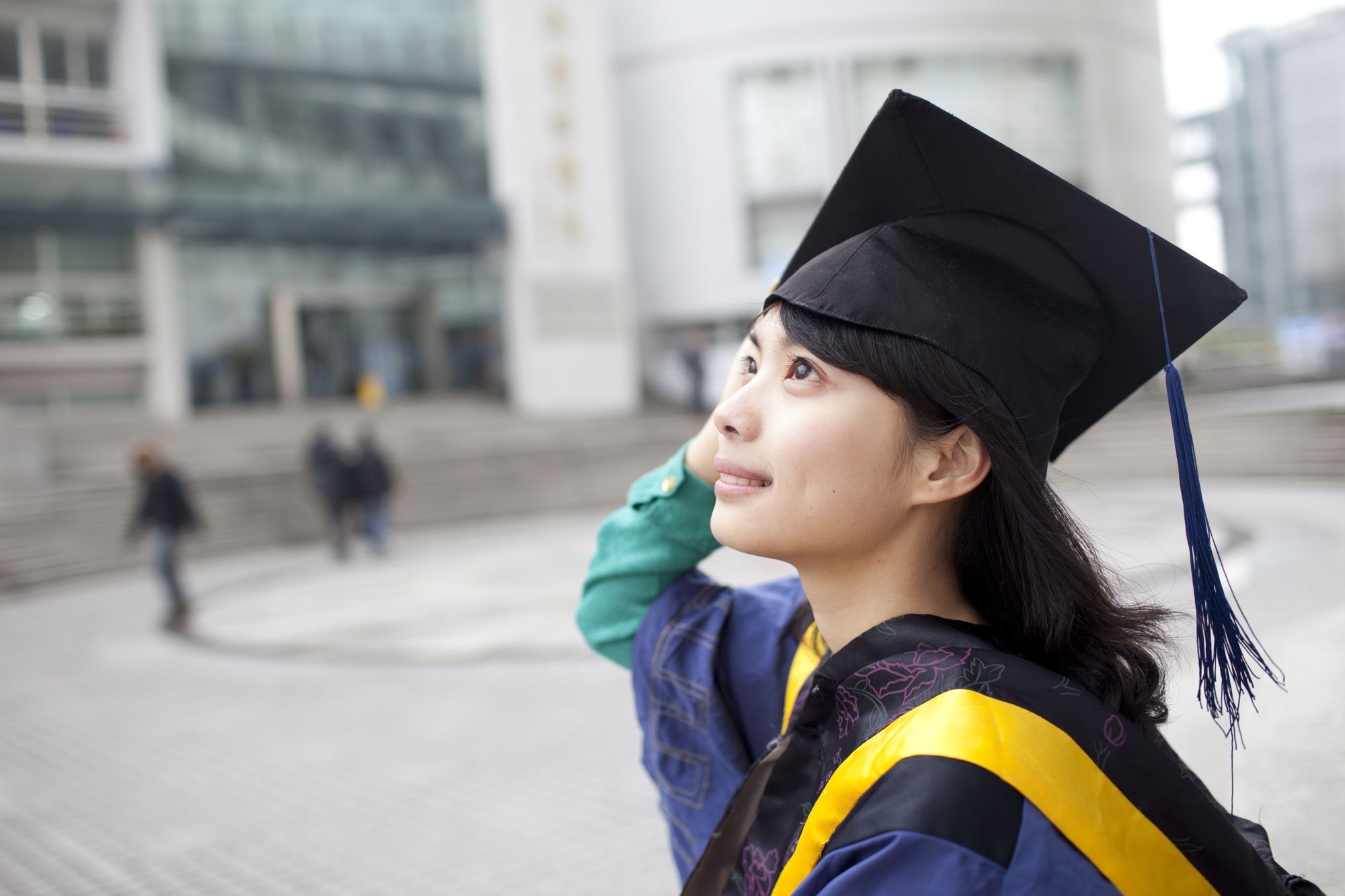 Young girl after her Masters Degree graduation ceremony